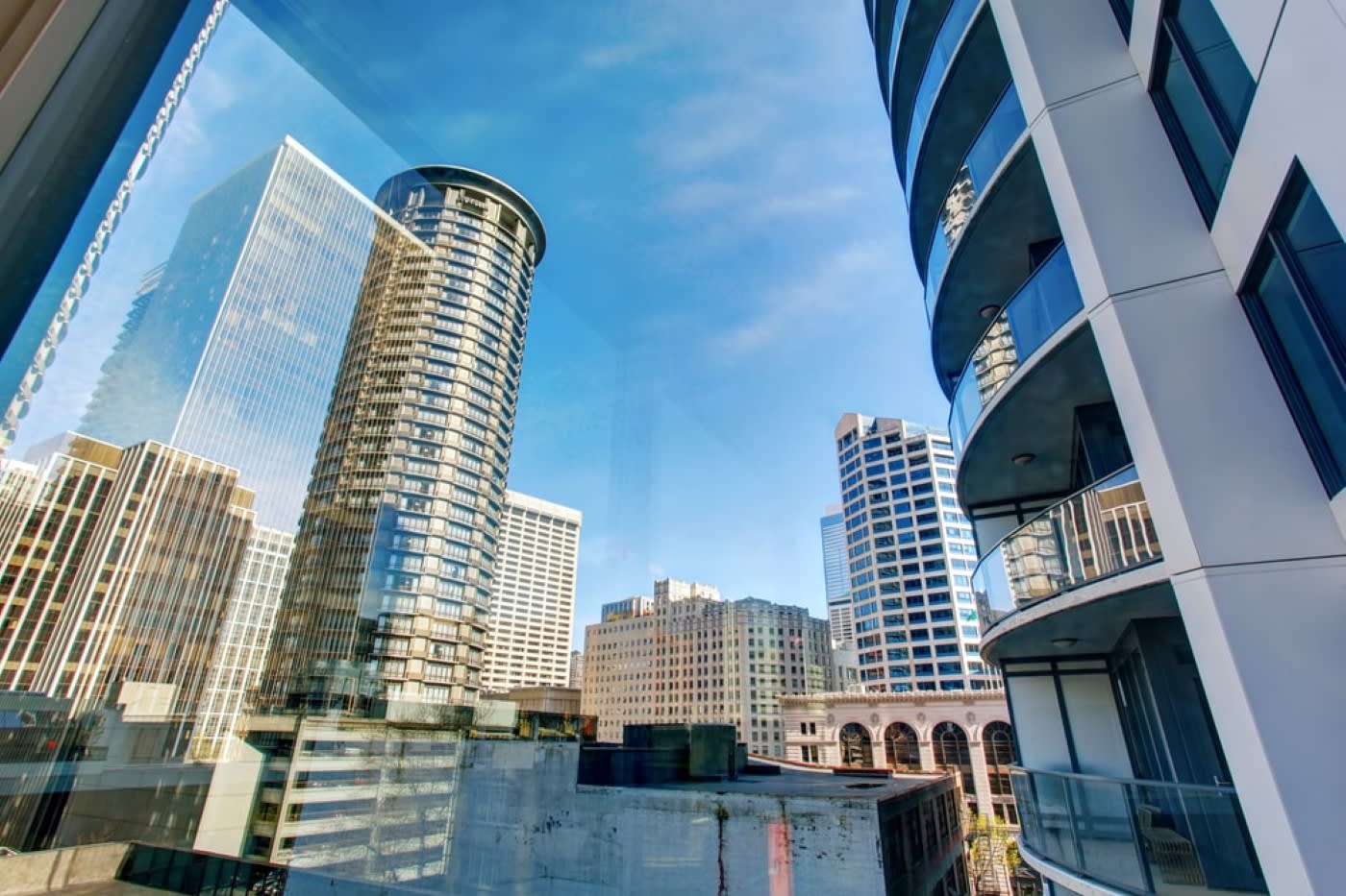 City view with large skyscrapers and buildings in front of a clear blue sky in the heart of downtown Seattle