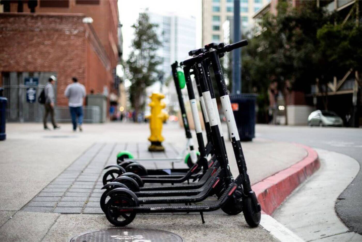 a bird scooter station on a sidewalk