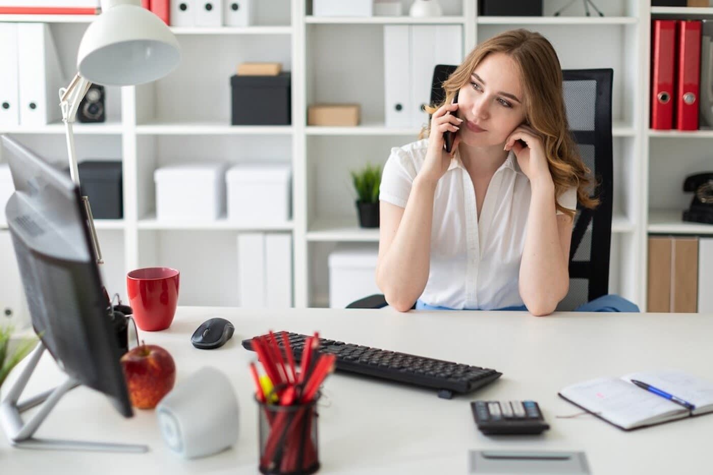 Woman on the phone at a desk