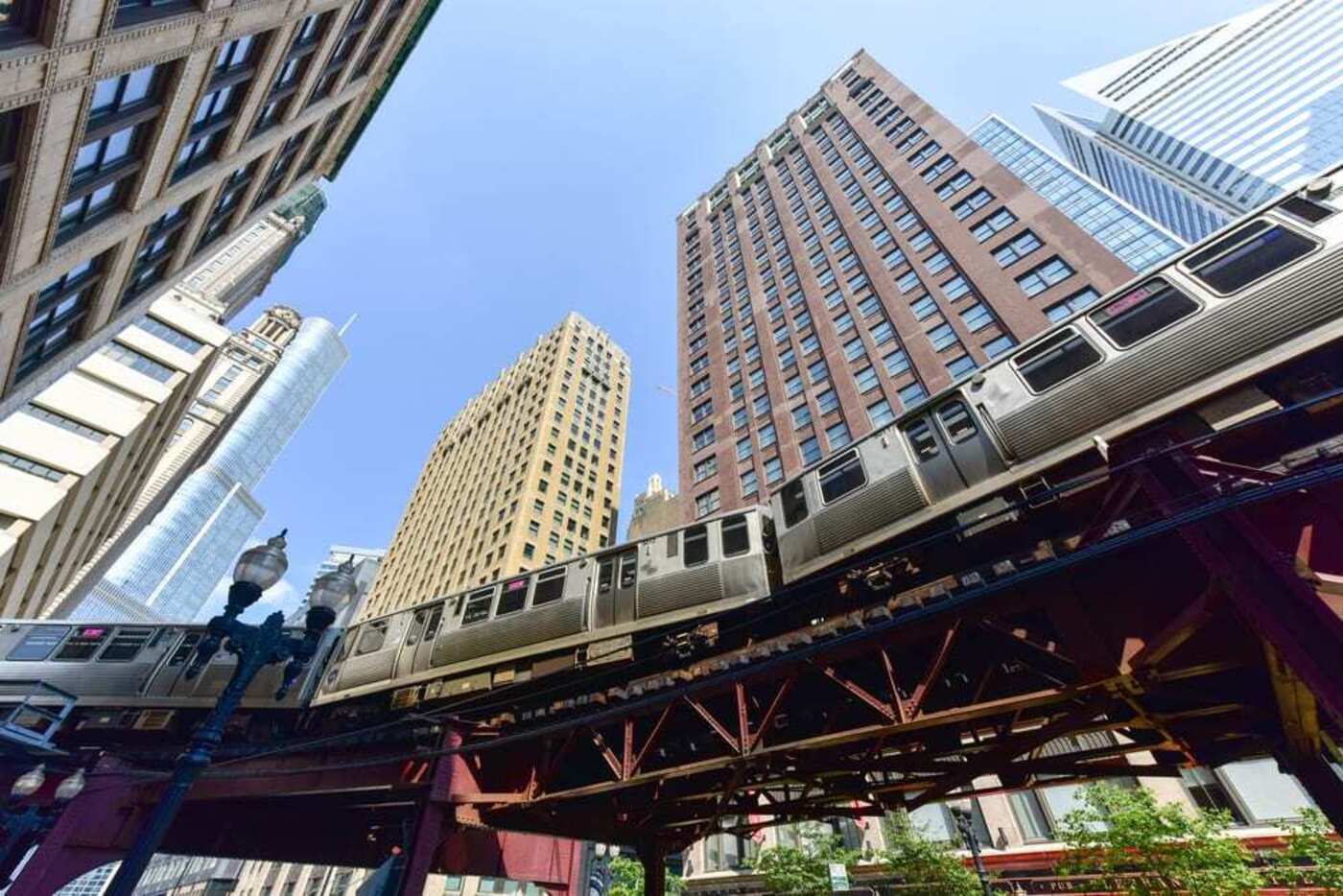 looking up at buildings and chicago metro train