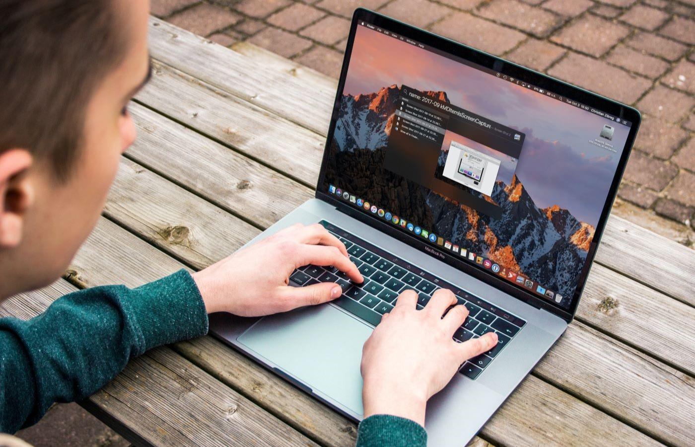 Man searching for funrished apartments on laptop