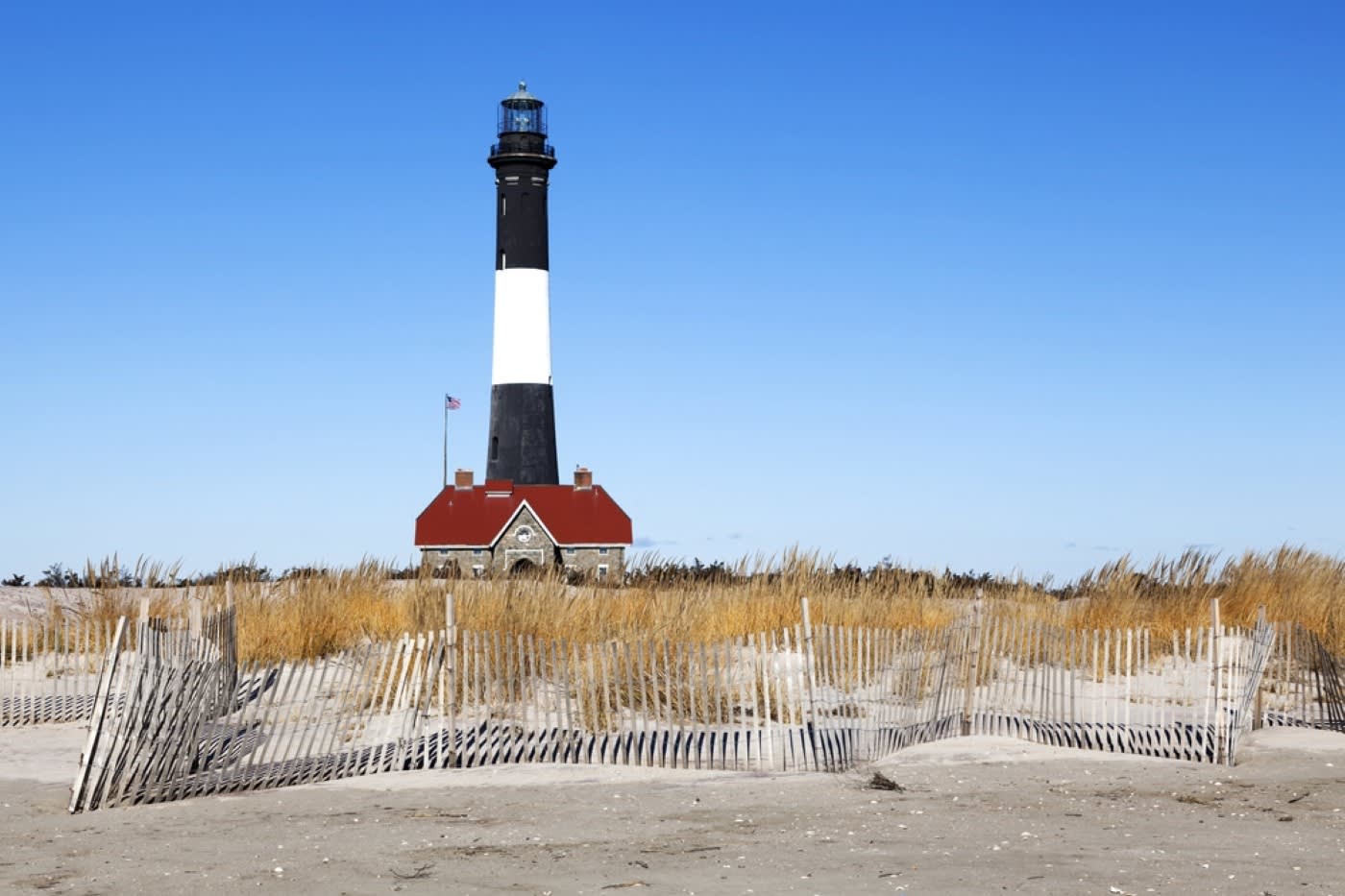 A lighthouse and beach of Fire Island, New York