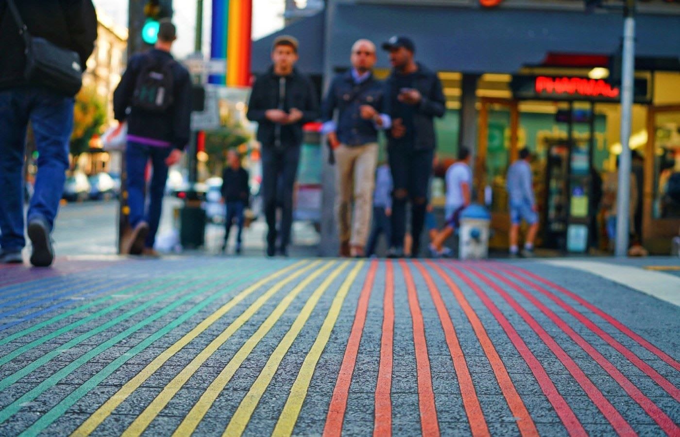 A pedestrian crossing in san francisco colored in the pride flag colors