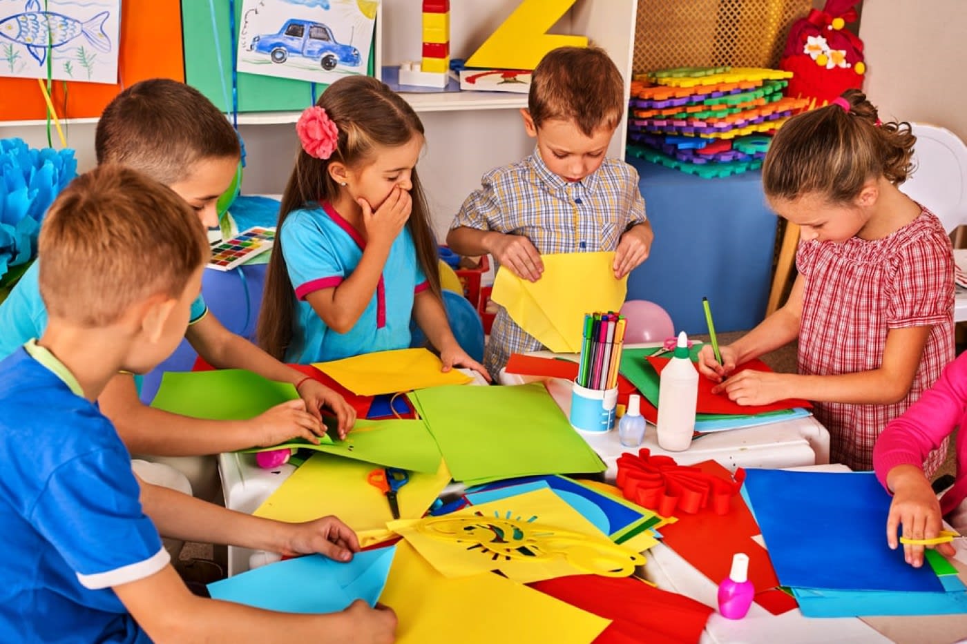 children in school doing arts and crafts projects