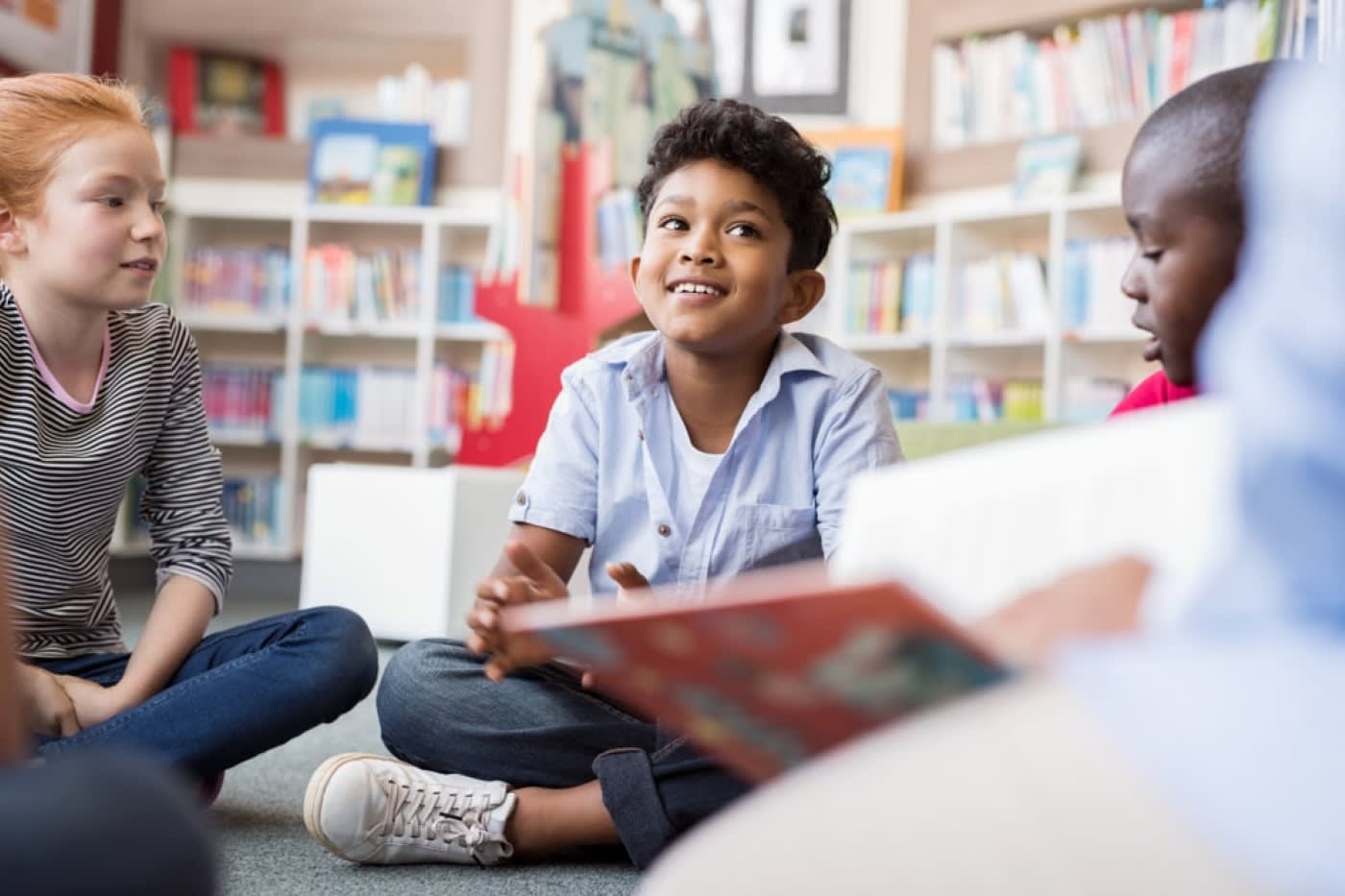 children at school having having a circle reading discussion