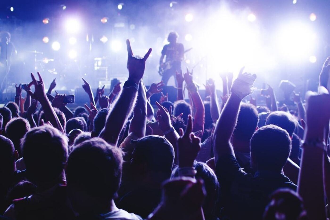 blueprint blueground living in cambridge silhouette of people in front of stage lights band of rock stars concert crowd
