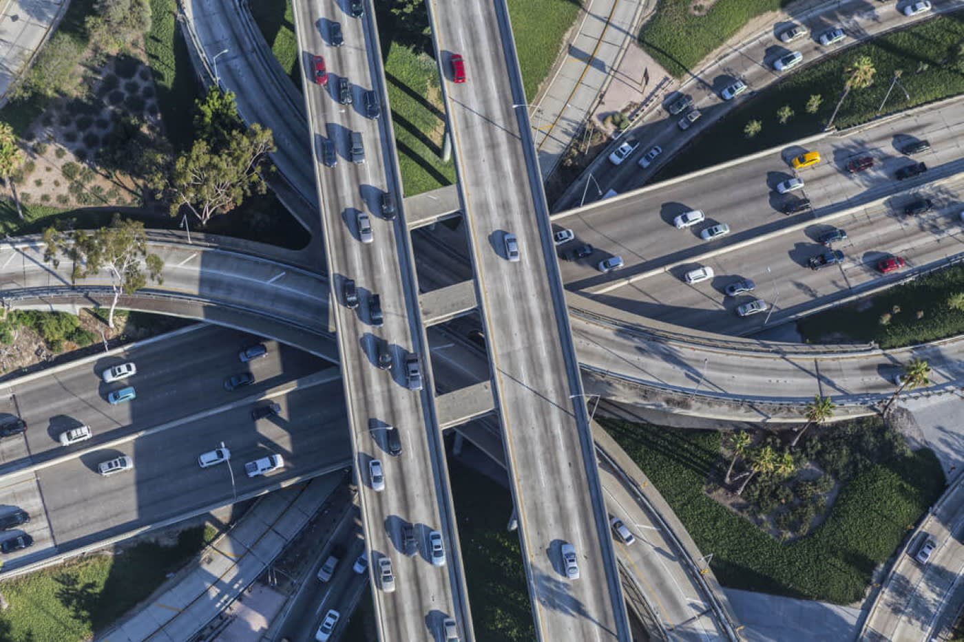 birds eye view of a major highway and lots of cars driving around