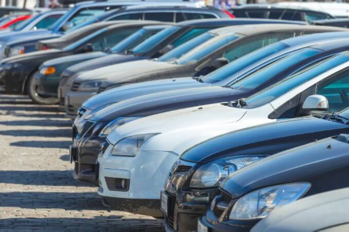 a line of cars in a parking lot