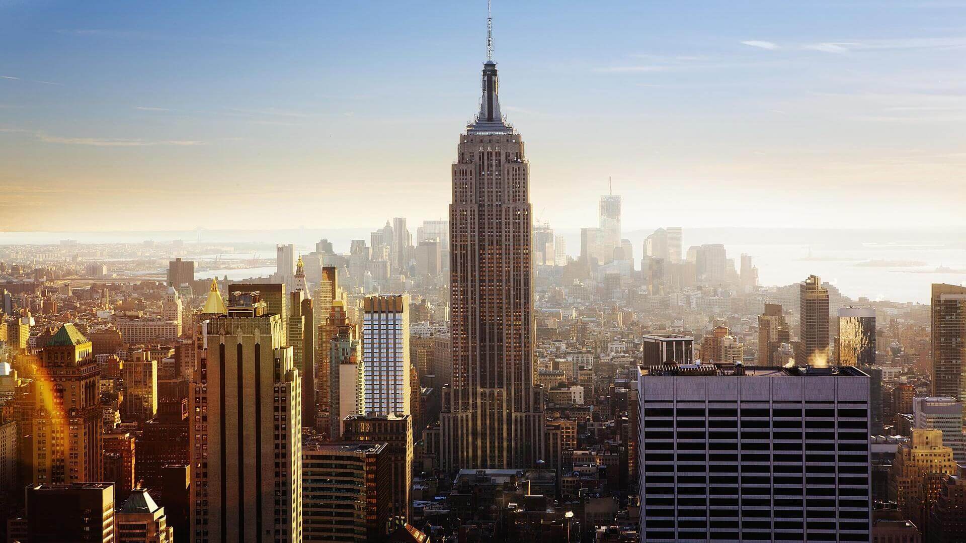 month to month lease in NYC empire state building in the center of NYC city during sunset