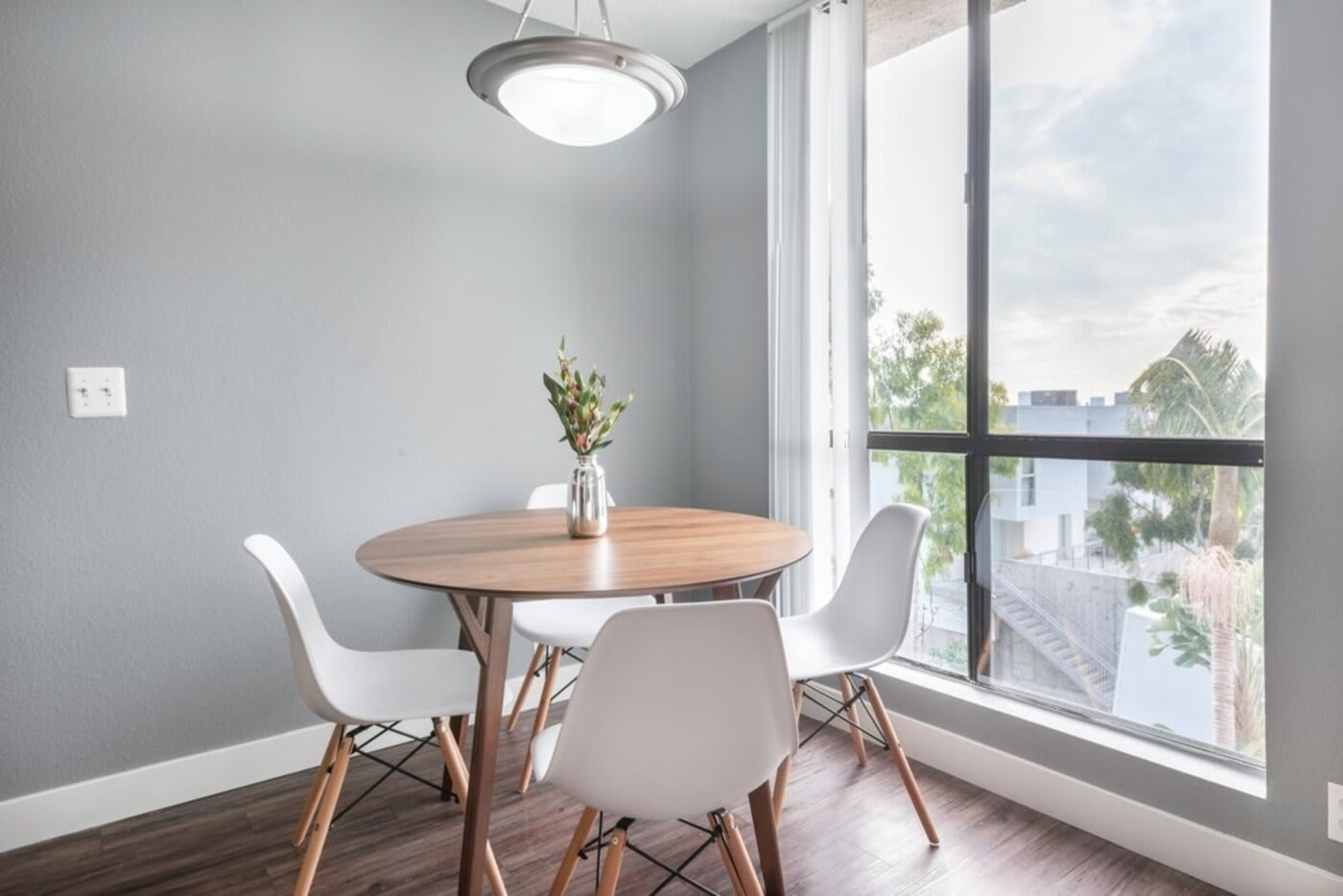 blueprint blueground short term rental los angeles white dining set in corner against large window