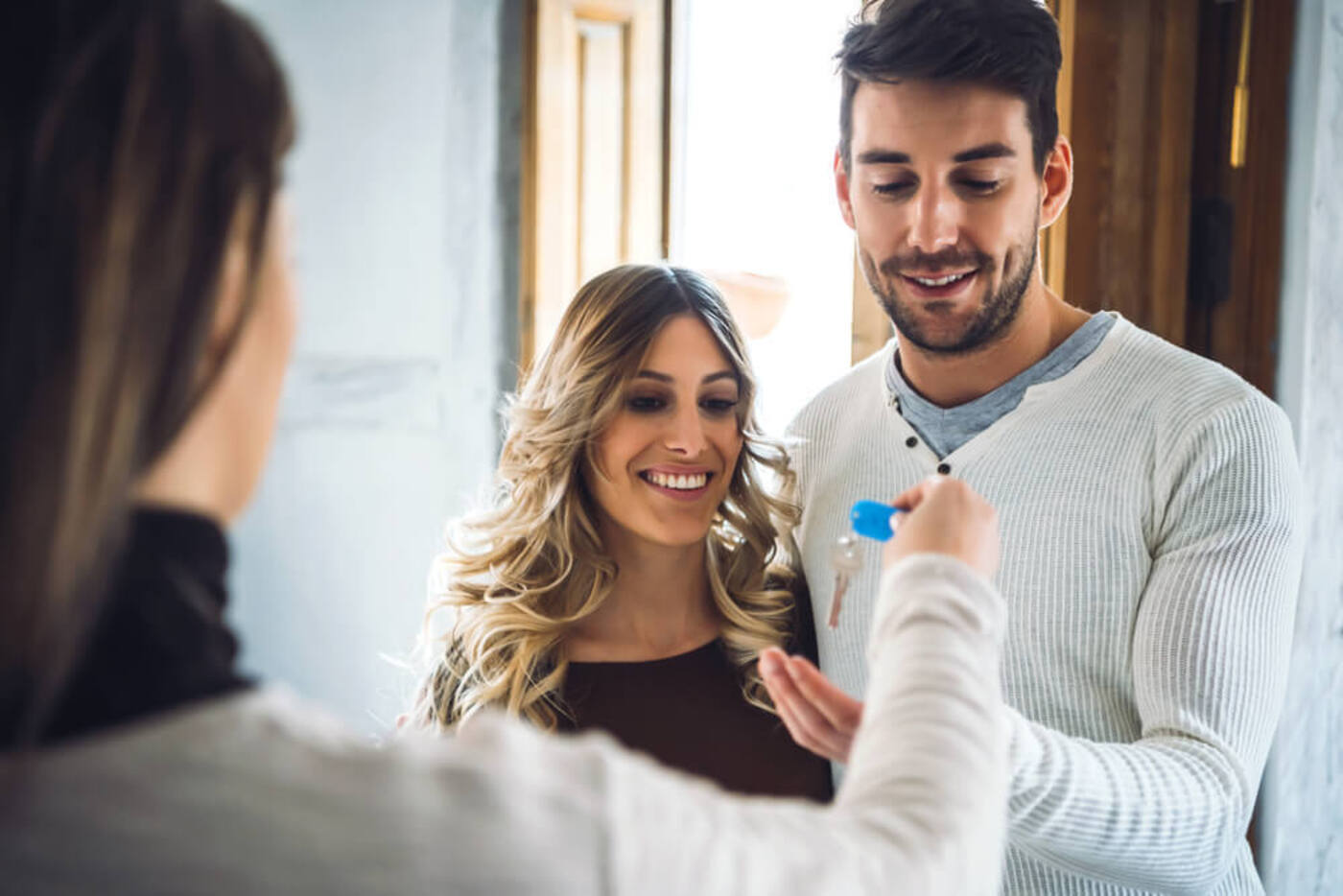 two people moving in together getting a key to their new apartment