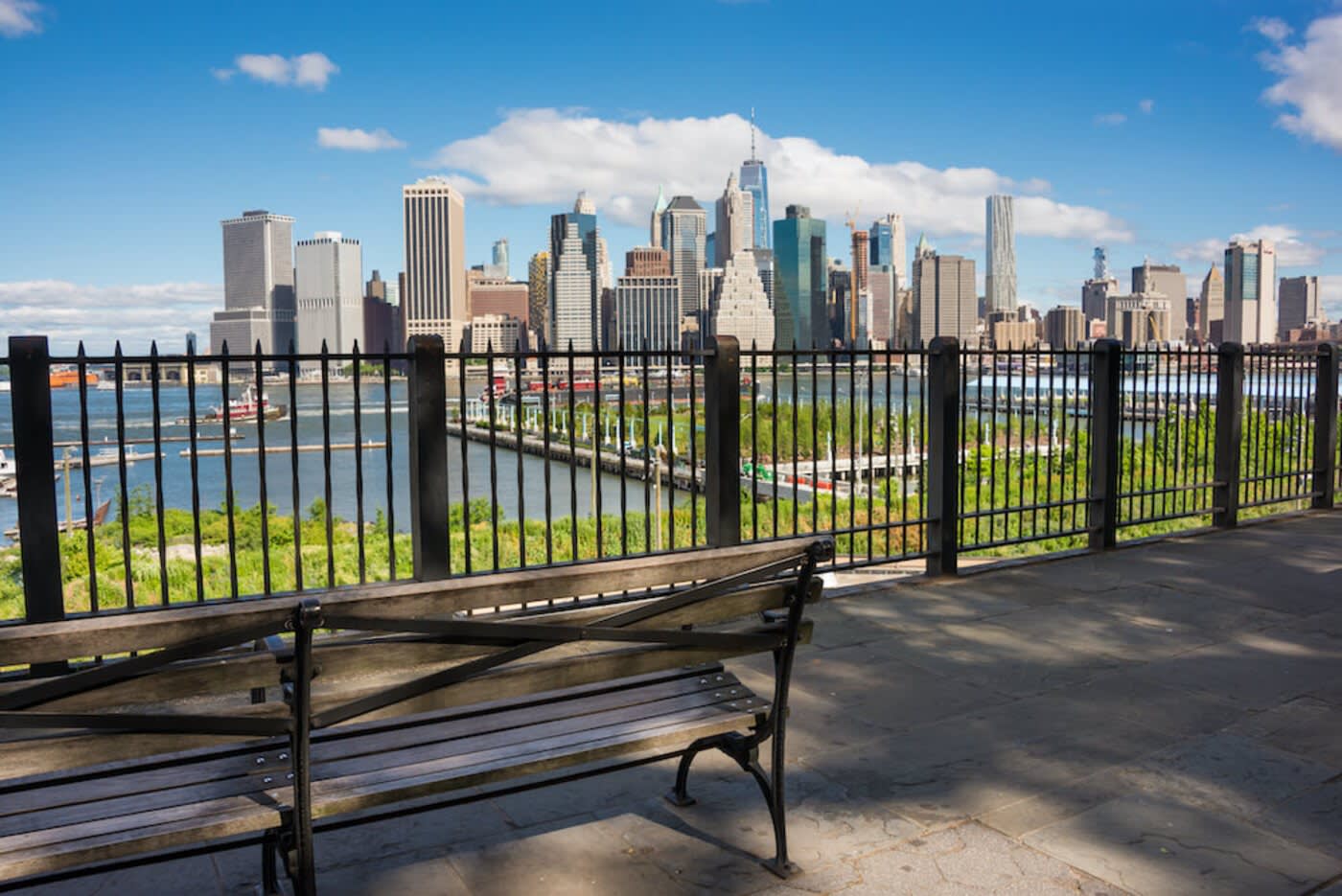 A bench in Brooklyn overlooking Manhattan, NYC