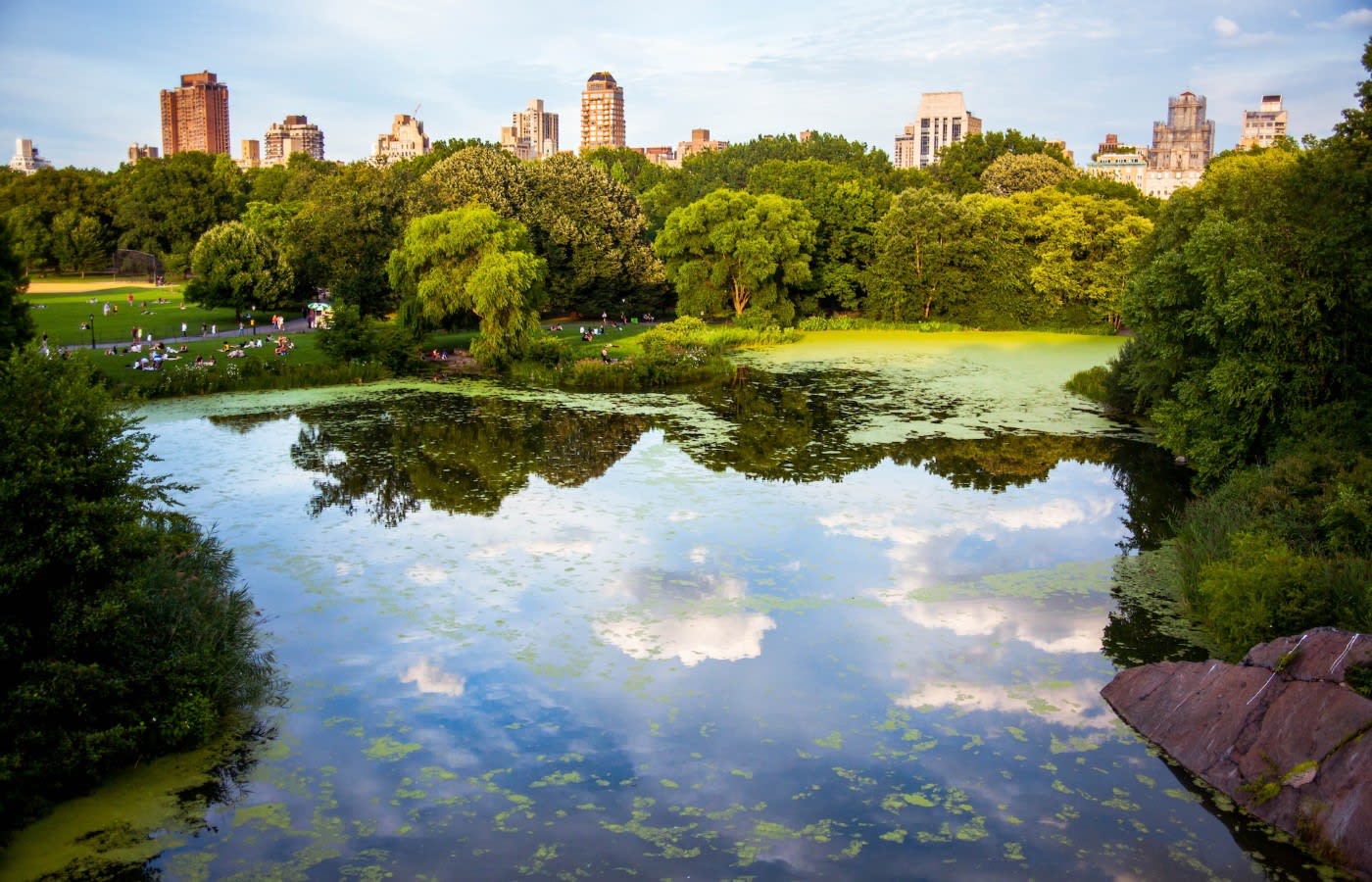 Lake in Central Park NYC with skyscrapers in the background