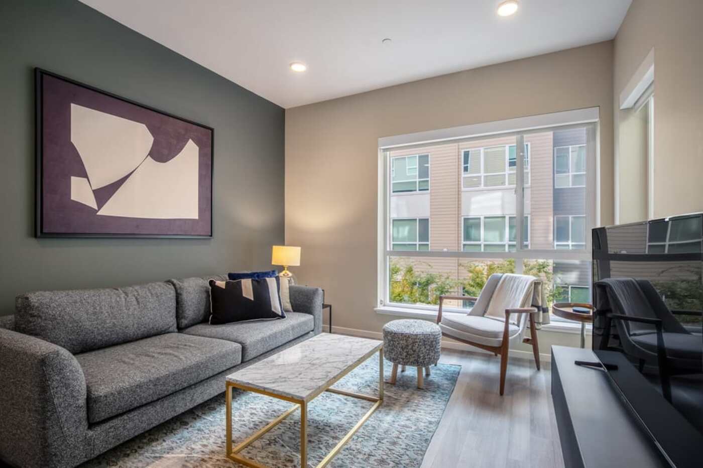 stylish corporate apartment living room decorated by Blueground