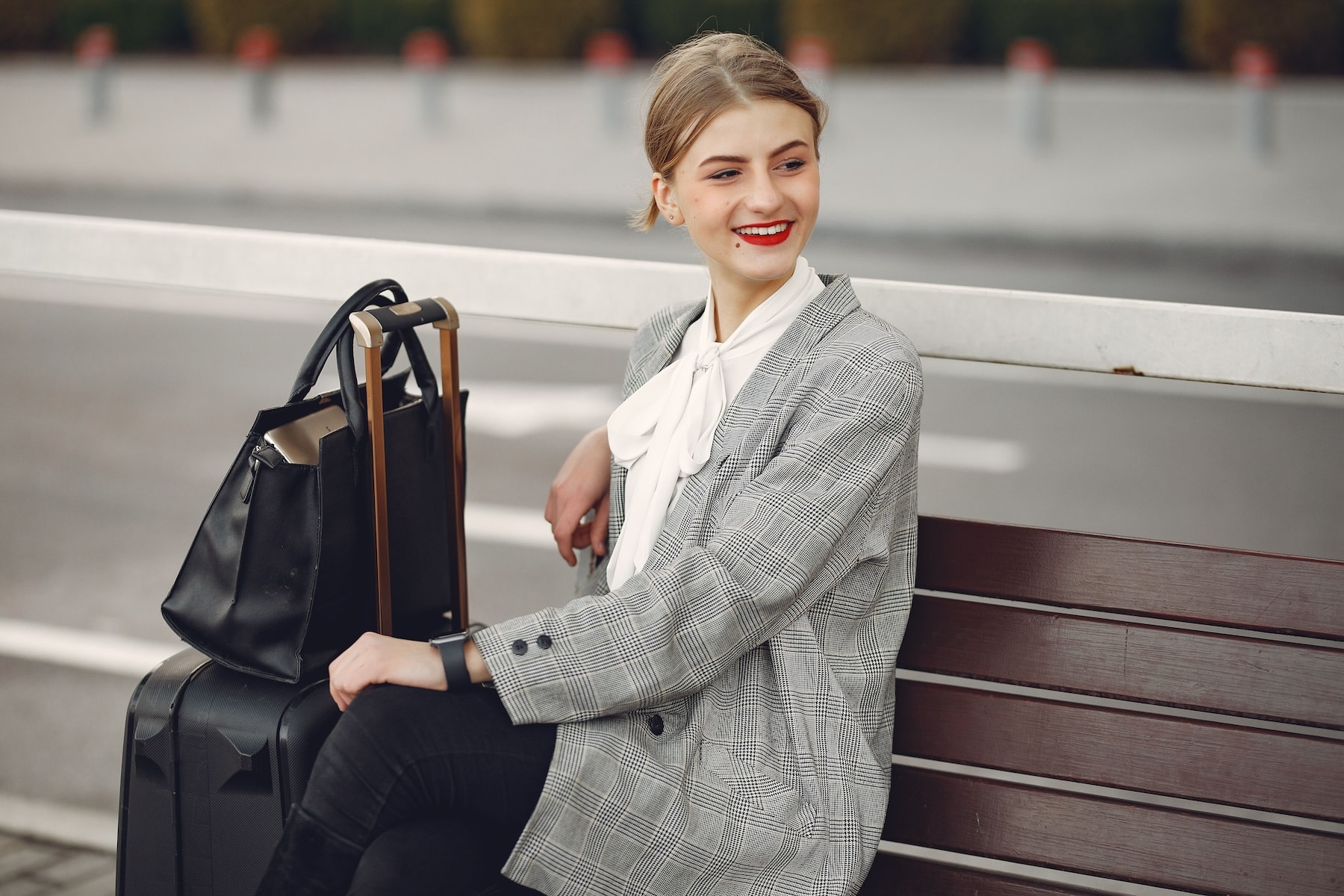 woman at train station with bags