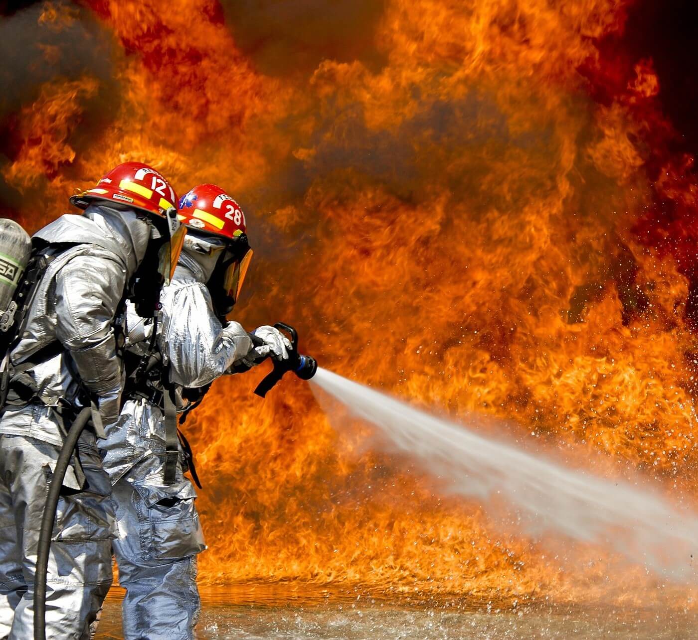 firefighters struggling to put out a home fire