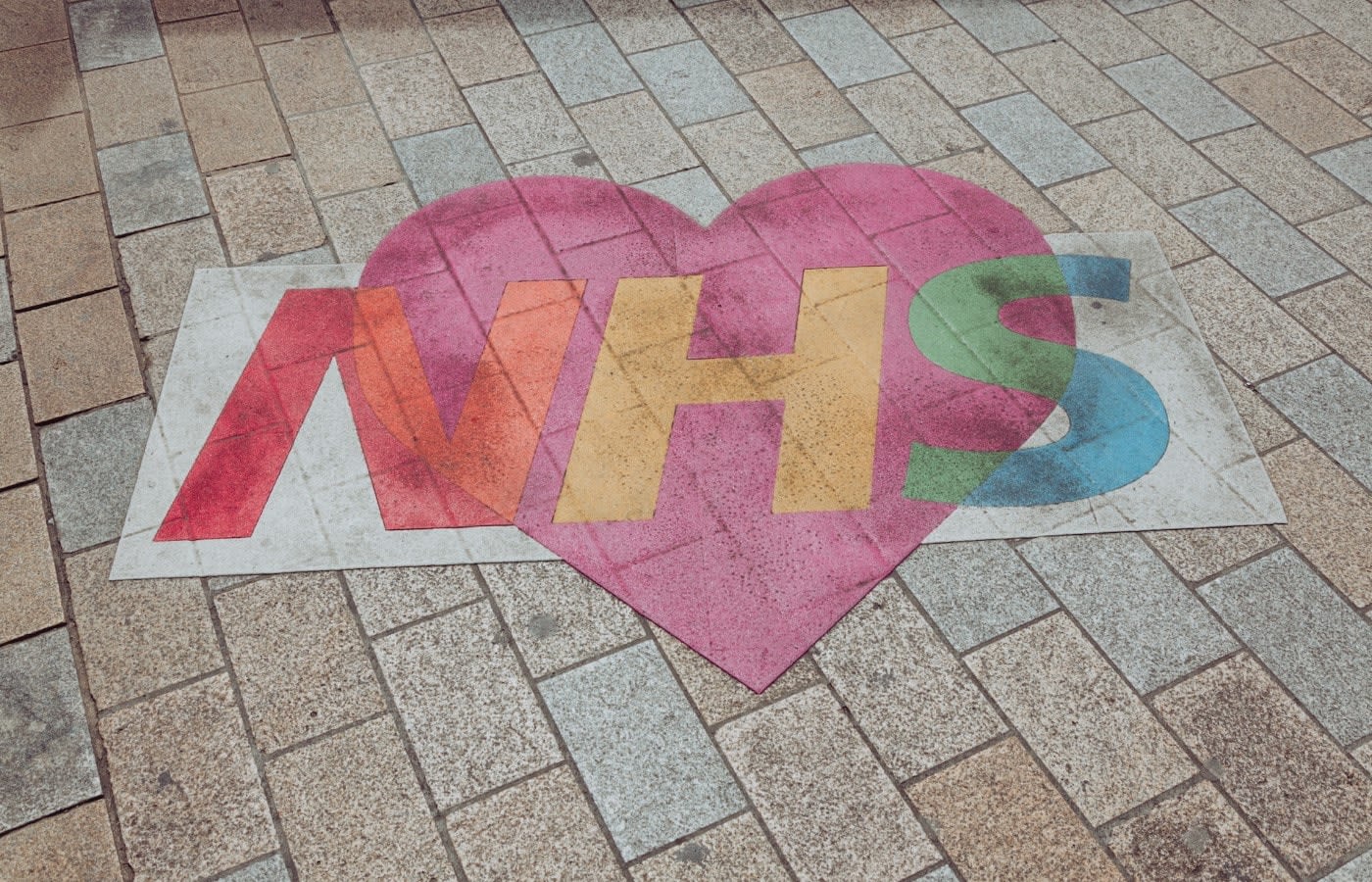 NHS logo inside a heart 
