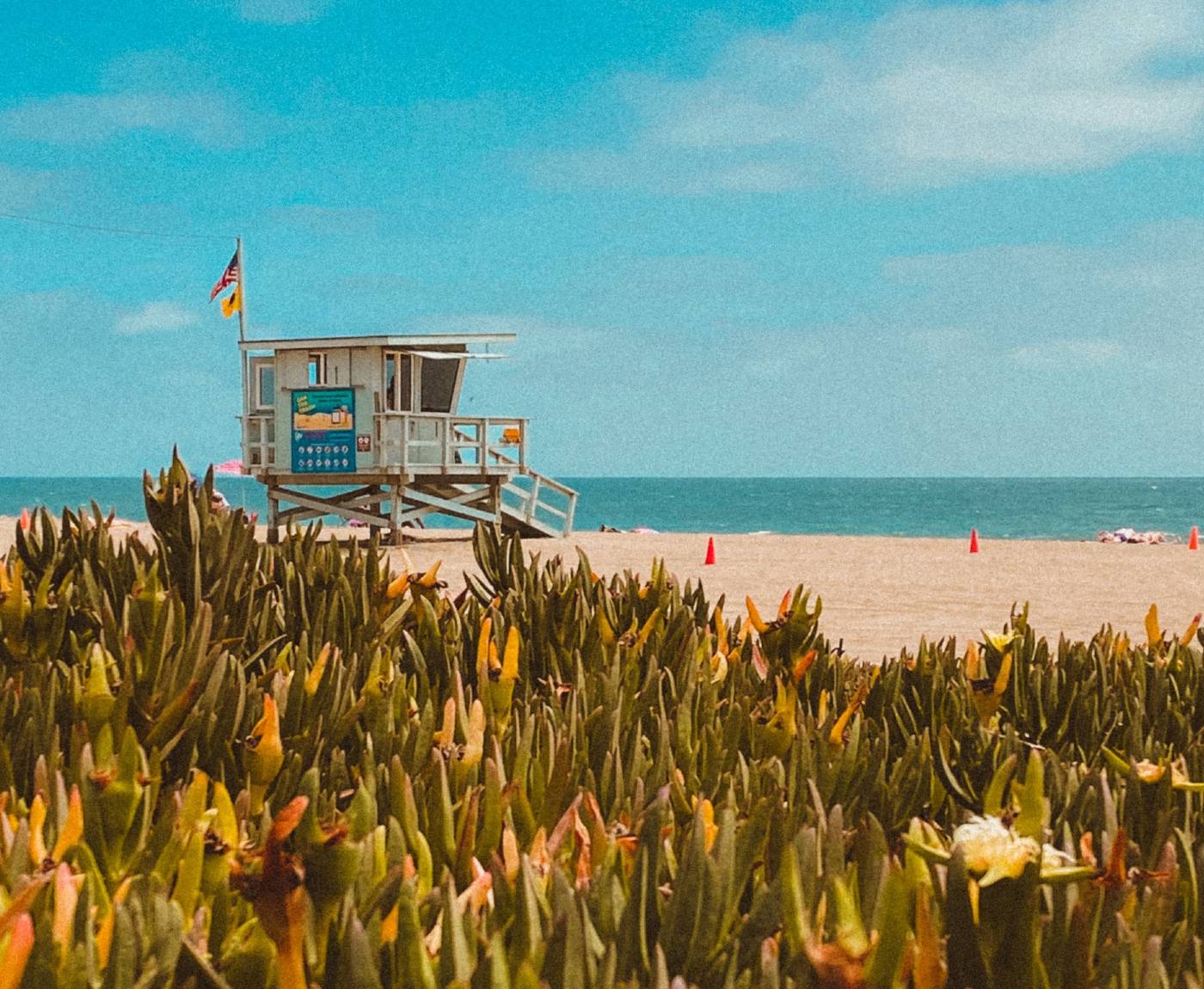 beach in malibu with a lifeguard shed