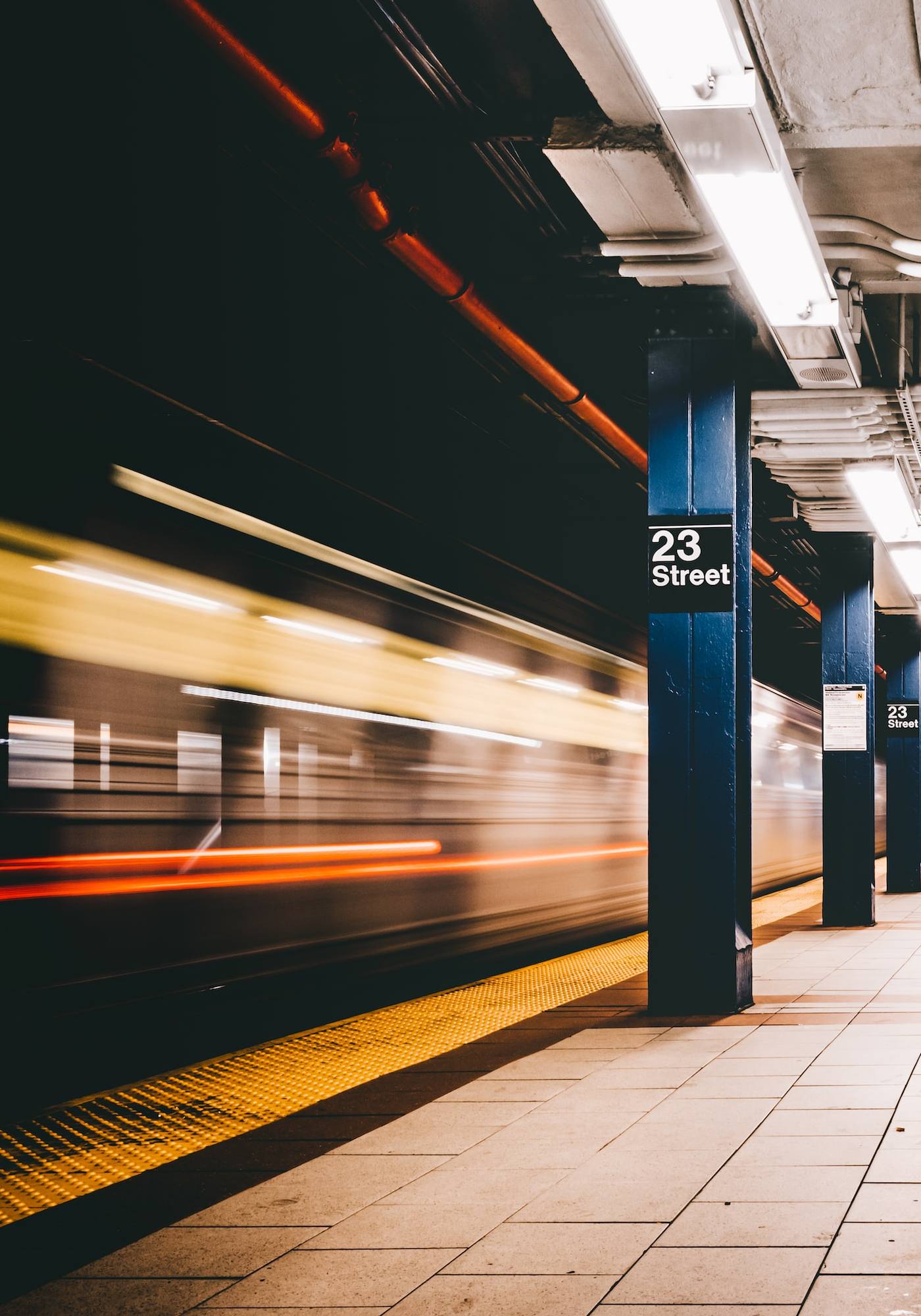 nyc 23rd street subway station, train leaving platform