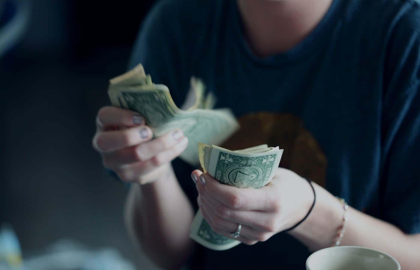 A girl paying with cash