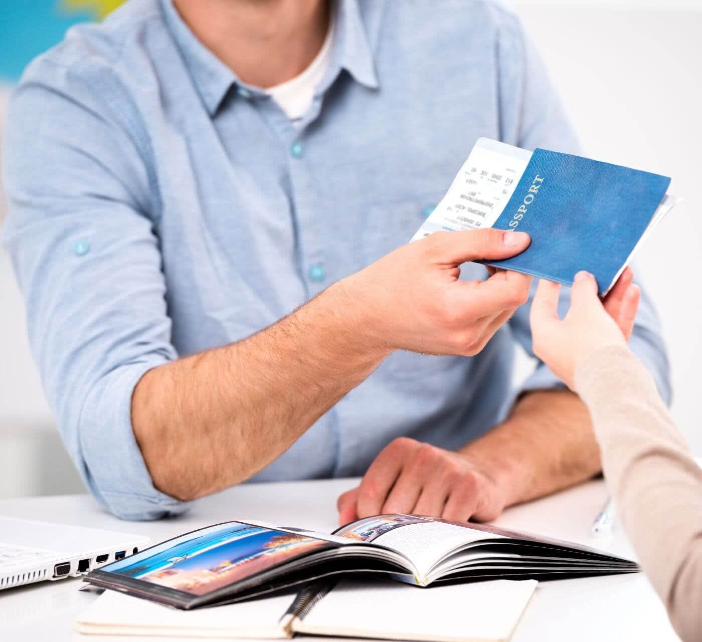 man applying for a visa holding a passport