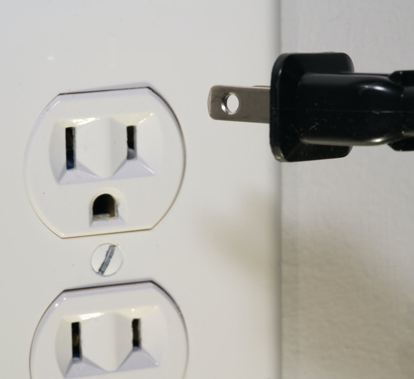 cable being plugged into the wall