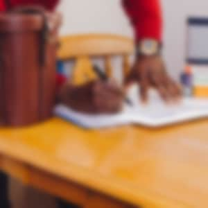 a man signs documents