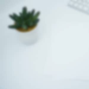 documents on a desk next to a keyboard