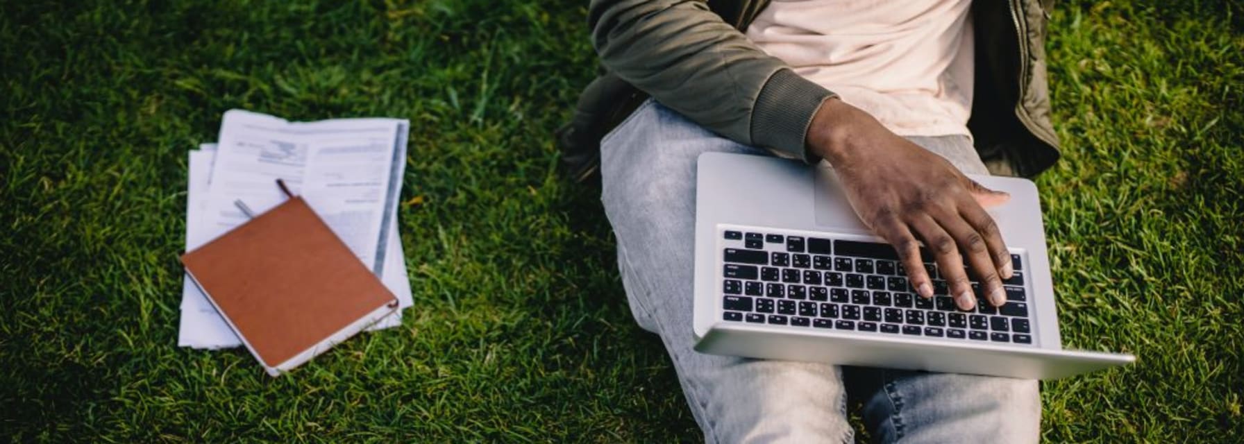 Person working outside on laptop