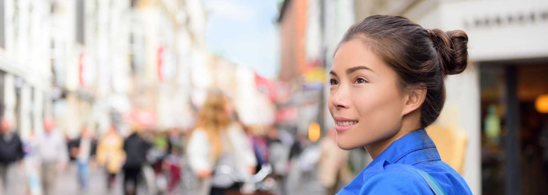 Woman on a European street looking around