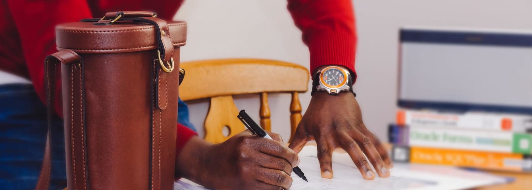 a man signs documents