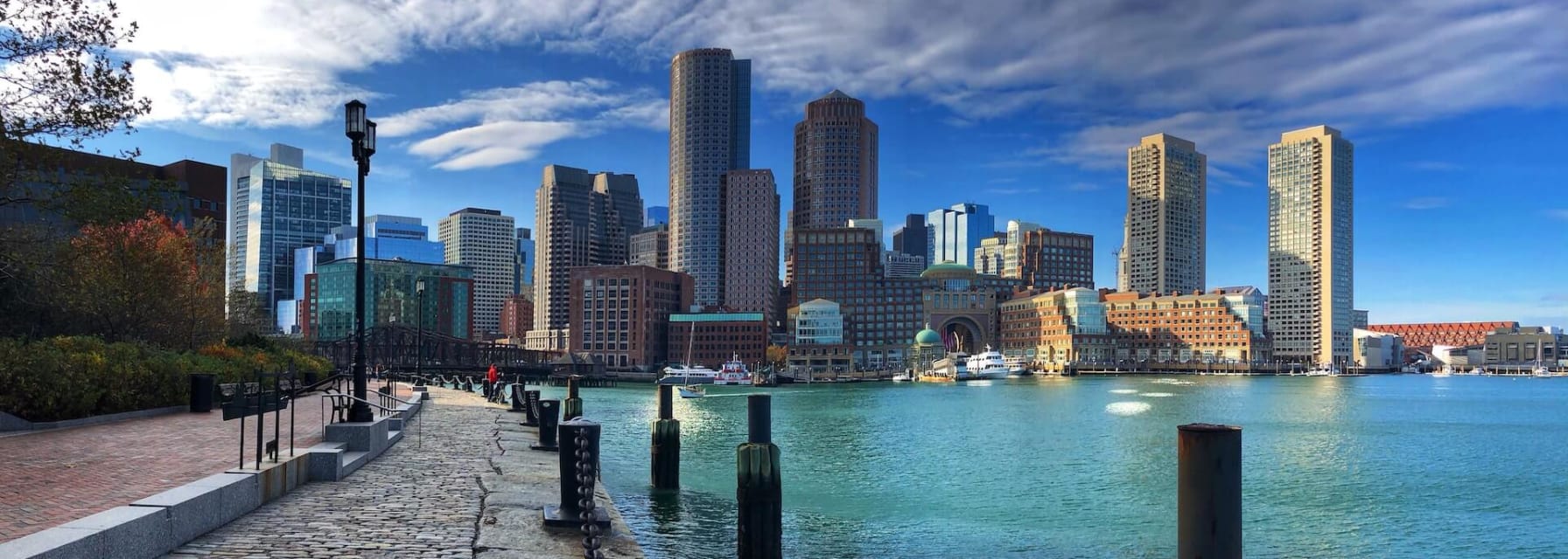 the boston harbor and skyline with clouds overhead