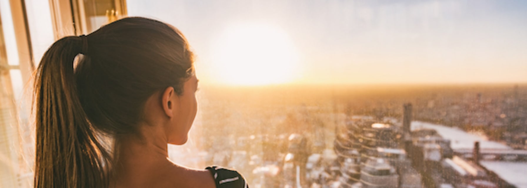 woman looks out at skyline