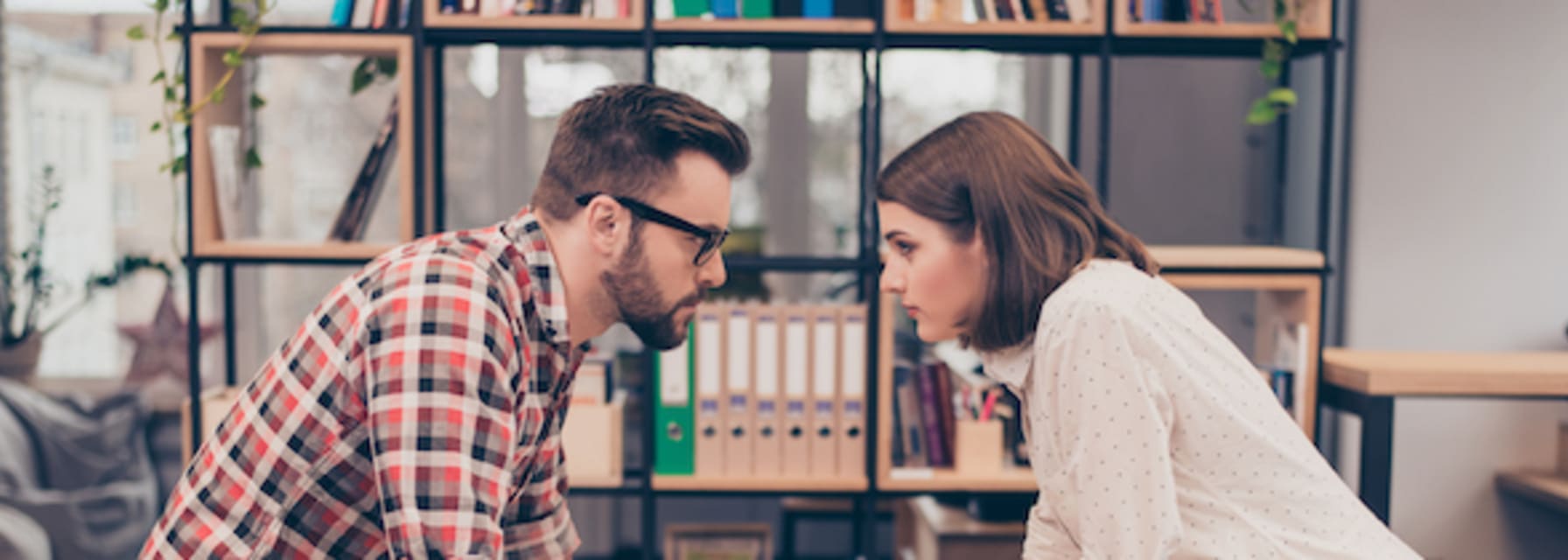 Man vs woman. Two concentrated business partners quarreling.