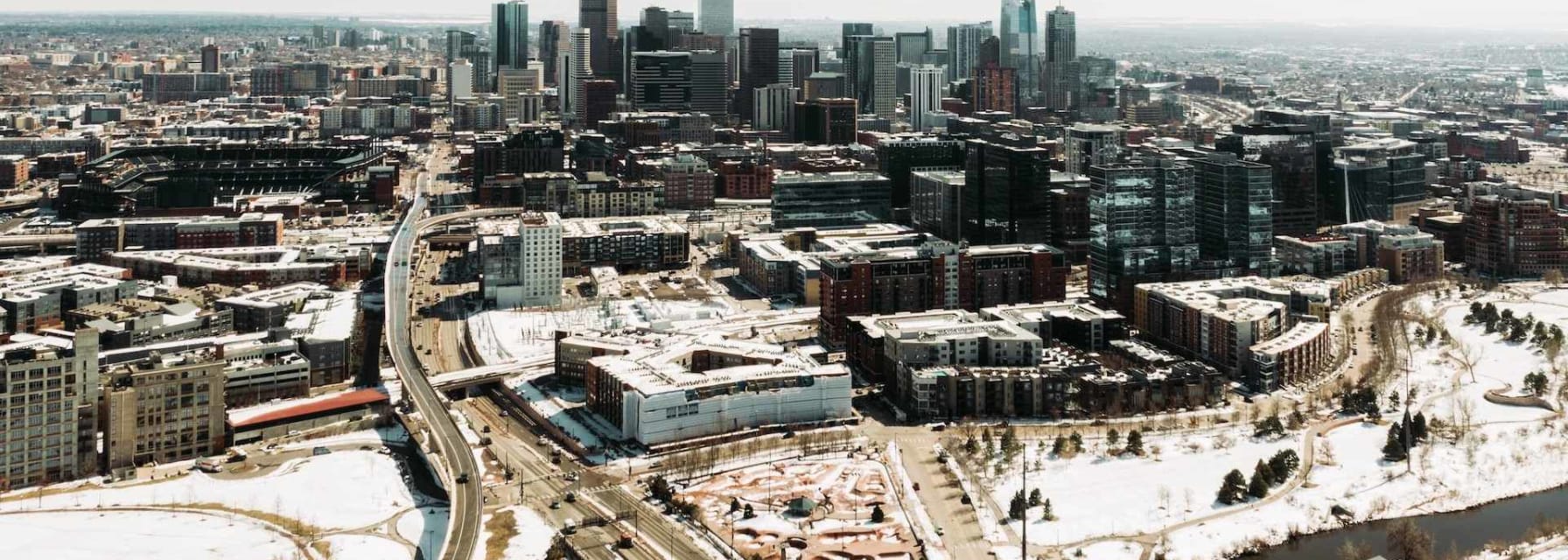 An aerial shot of downtown denver at midday.