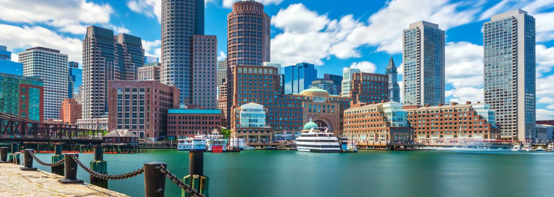 Port in Boston city with skyscrapers in the background.