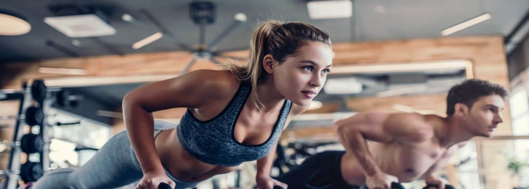 gyms boston couple working out in the gym with kettle bells