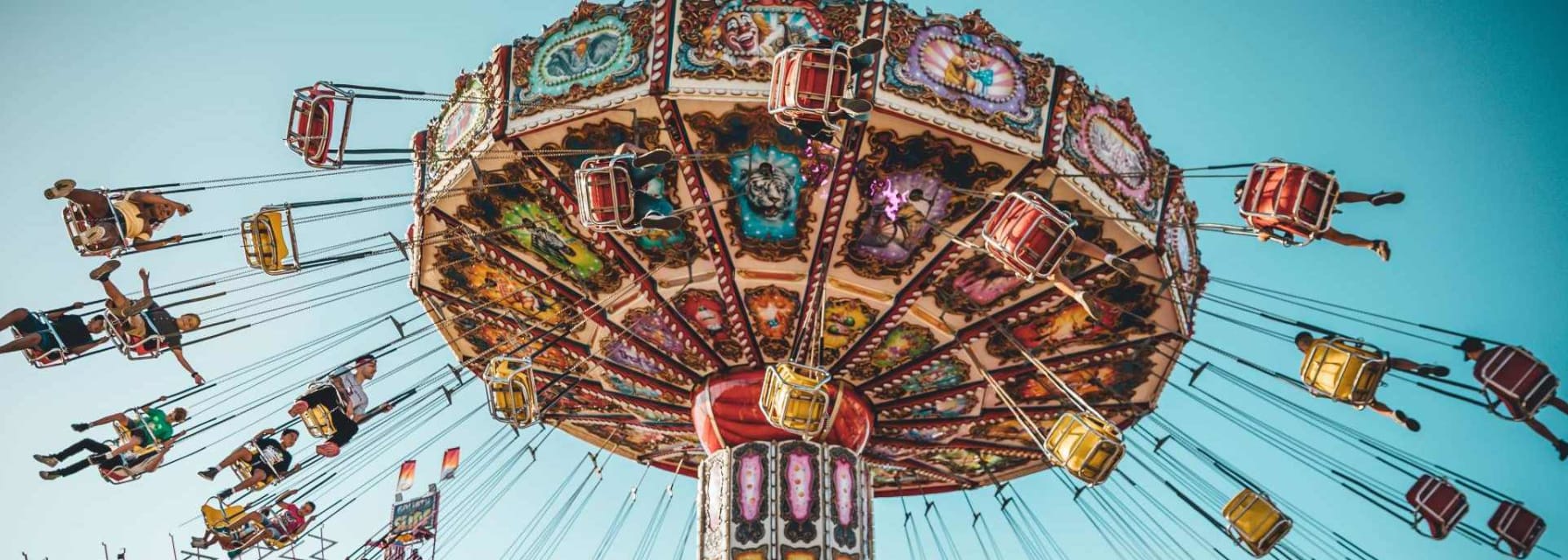 nyc street fair carnival swing ride on a sunny day