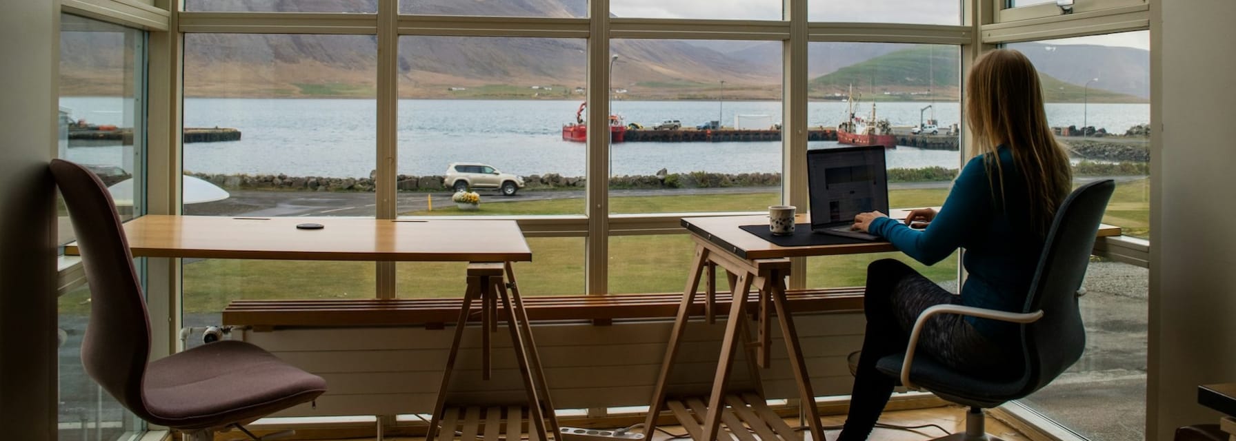 woman working remotely with a view