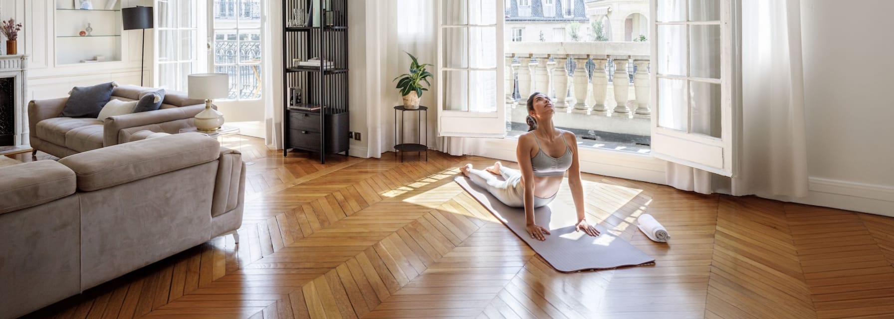 woman doing yoga in paris apartment