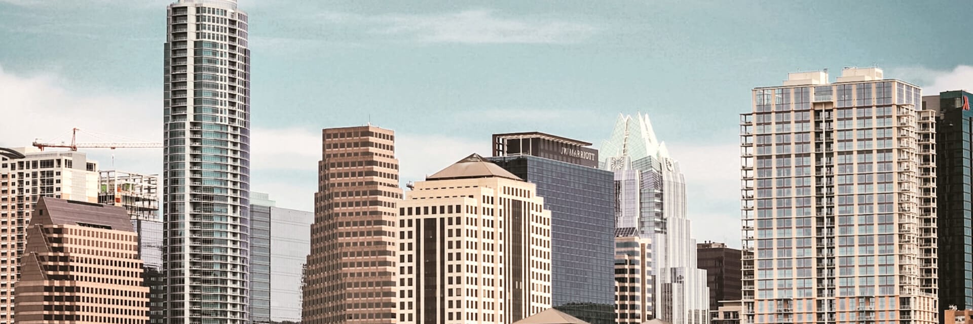 A view of the sky in downtown Austin with skyscrapers.