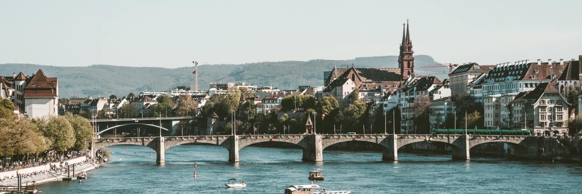 A view of a bridge crossing the Rhine river in Basel, Switzerland.