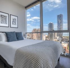 Bedroom in Chicago with view of skyscrapers