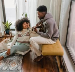 Couple with dog in an apartment