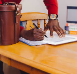 a man signs documents