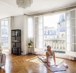Woman doing yoga in her Paris Blueground apartment