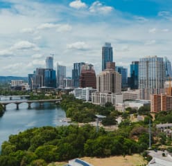 An aerial view of central Austin with the colorado river in sight.