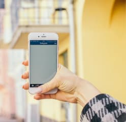 A woman uses her smartphone outdoors