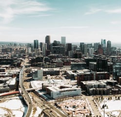 An aerial shot of downtown denver at midday.