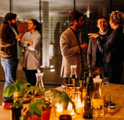 people mingle before a dinner party